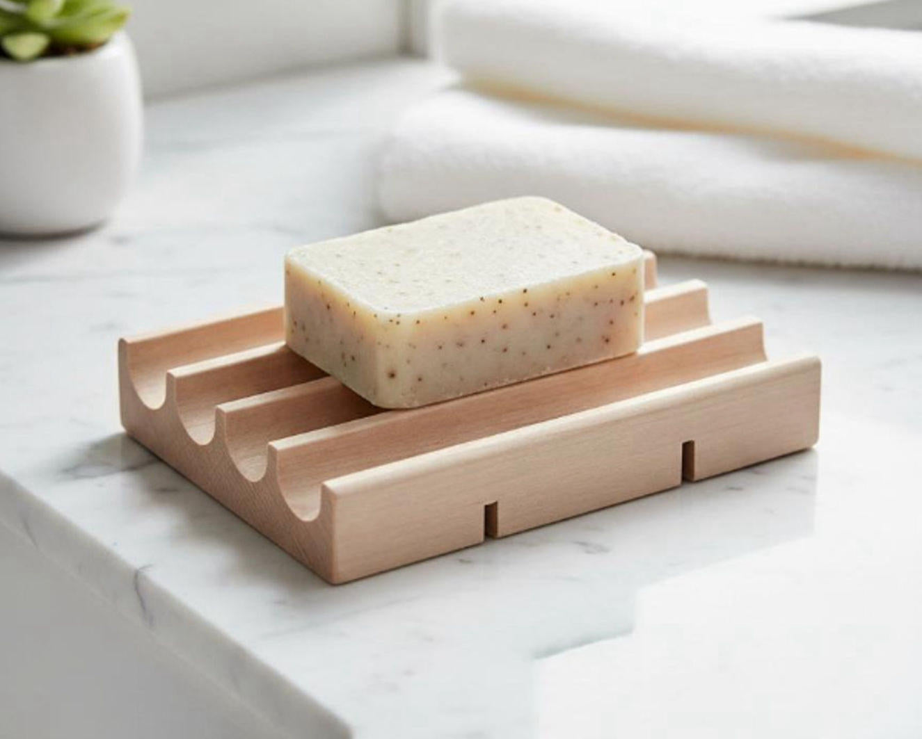 Bar of soap on a wooden soap dish with drains made in Michigan